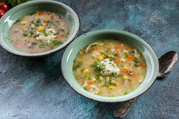 Pea soup with smoked meat, vegetables and greens. Delicious and healthy homemade food.