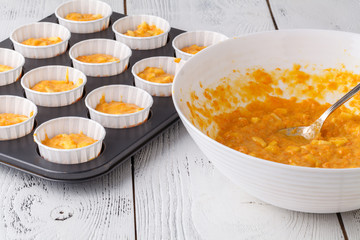 Pumpkin muffins with cream and candied fruits