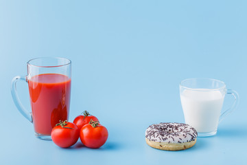 Healthy food  or fat food, juice or donut with milk