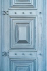 Wooden panel background close up. Part of a wooden door or wall.