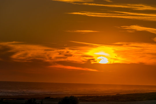 Golden sunset on the beach with the sun over the beach