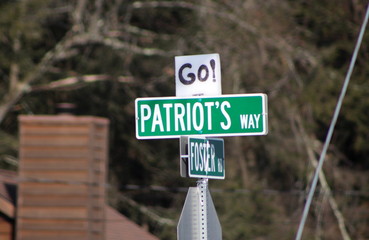 Patriots way street sign with NE Pats logo.