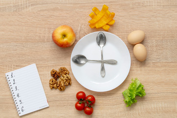 clock fruit plate, cherry Apple salad yellow pepper slices, walnuts, two boiled eggs and a Notepad with numbers from 1 to 6