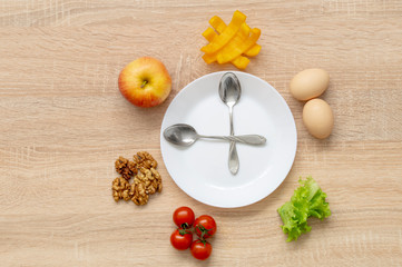 clock fruit plate on wooden background