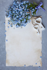 Bouquet of forget-me-nots and congratulatory paper, letter and keys