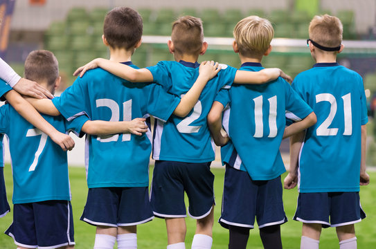 Young Football Players. Young Soccer Team Supporting Friends During Penalty Kicks. Soccer Match For Children. Young Boys Playing Tournament Soccer Match. Youth Soccer Club Footballers © matimix
