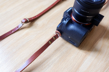 Brown leather camera strap - Powered by Adobe