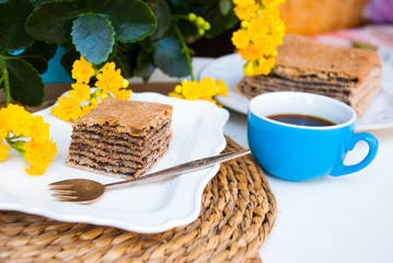 Pastries with poppy with cup of coffee. Nice spring breakfast.