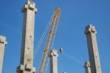 Fototapeta na wymiar yellow crane on construction site