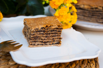 Piece of pie with poppy. Traditional tajil katlama pie.
