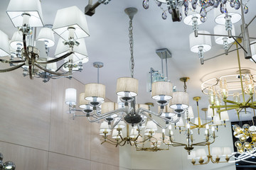 the ceiling is hung with luminous modern chandeliers