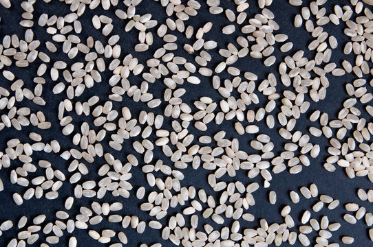 White Round Rice On A Black Table