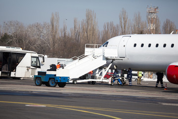 Passenger plane at airport in winter afternoon. plane on airport platform in  winter. Airplane on summer strip in winter