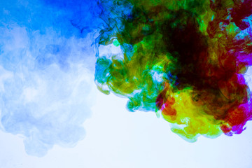 Fototapeta na wymiar colorful paints dissolve in water, abstract background