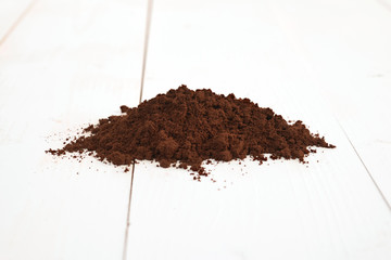 coffee ground isolated on a wooden table