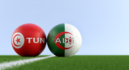 Tunisia vs. Algeria Soccer Match - Soccer balls in Tunisian and Algerian national colors on a soccer field. Copy space on the right side - 3D Rendering 