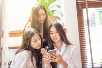 Group of business asian women discussion using smartphone
