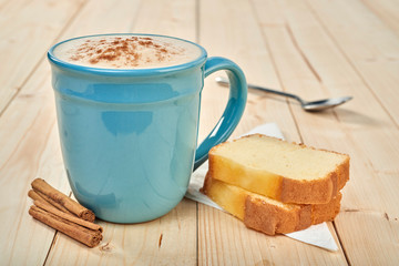 coffee with pound cake on wooden table