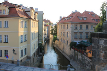 Fototapeta na wymiar View of the river chertovka and old houses in the old town of Prague in the Czech Republic
