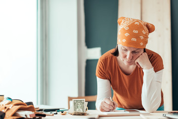 Female carpenter with financial problems