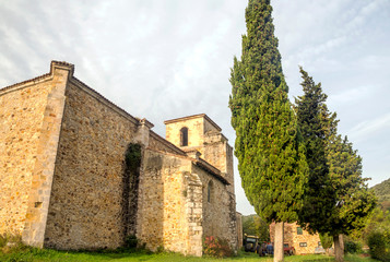 Facade of romaneque church in the north of Spain in rural town.