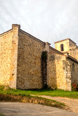 Fototapeta na wymiar Facade of romaneque church in the north of Spain in rural town.