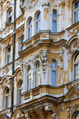 Fototapeta na wymiar Wall of a spotted historic building in Prague Czech Republic