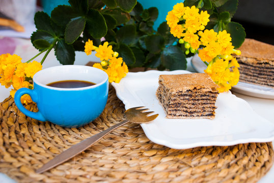 Pastry with poppy with cup of coffee. Nice spring breakfast. Traditional tajil katlama pie.