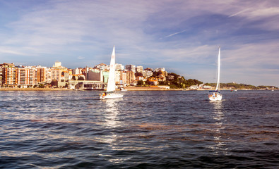 Santander, Spain-Septemebr 2019. View of the city of Santander with the sea and the people wlaking. You can see the modern building in the background in a sunny day.