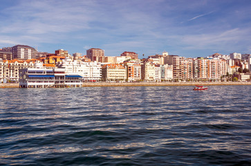 Obraz premium Santander, Spain-Septemebr 2019. View of the city of Santander with the sea and the people wlaking. You can see the modern building in the background in a sunny day.