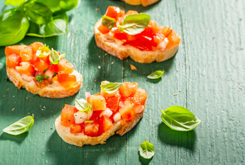 Classic italian bruschetta served on wooden board