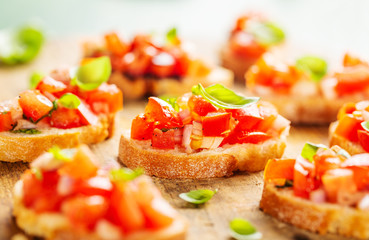Classic italian bruschetta served on wooden board