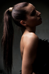 Beautiful young girl, with ponytail, in shallow focus, artistic