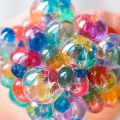 Children's and adult anti-stress toy to improve fine motor skills. Soft balls in the grid. Orbiz.