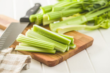 Celery sticks. Cutting celery stalks.