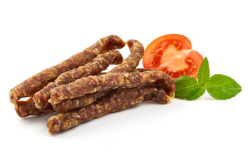 Dry wild meat sticks. Jerky sausages close-up, isolated on white background