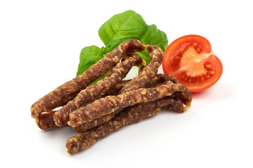 Dry wild meat sticks. Jerky sausages close-up, isolated on white background