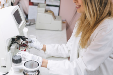 woman optician working in optic store