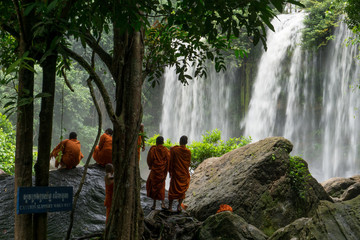 Buddihst monks at the Kulen Waterfall near Siem Reap in Cambodia