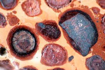 Macro photography of a natural sample of mineral rock-rough red bauxite stone. Beautiful texture of the stone.