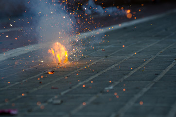 Firecrackers exploding in the street for the Fallas celebration in Valencia.