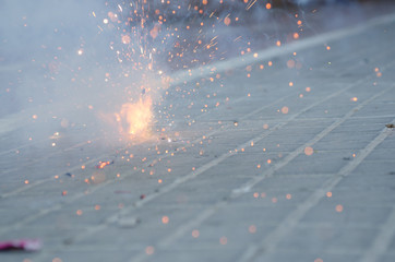 Firecrackers exploding in the street for the Fallas celebration in Valencia.