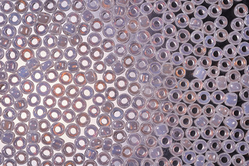 Background of glass beads for needlework. Macro shooting