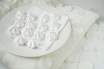 romantic white scene  of sweet meringue on plate, for wedding party