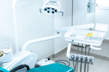 Photo of the bright dentist's office through the door ajar