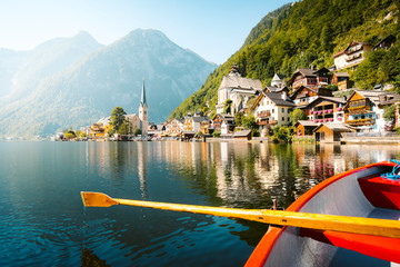 Classic view of Hallstatt with traditional rowing boat in summer, Salzkammergut region, Austria