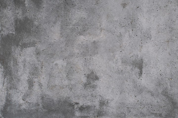 Concrete wall with stains and cracks