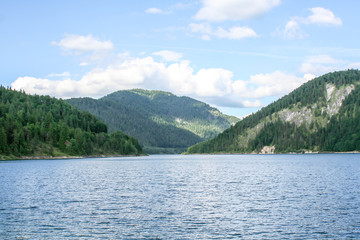 Fototapeta na wymiar far view over the lake to the mountains