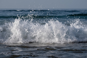 waves breaking on beach