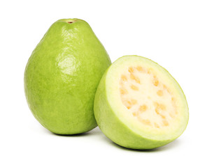 One whole and a half of ripe guava (isolated)